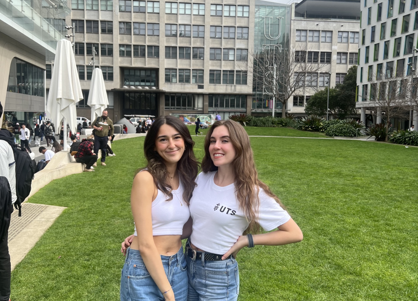 Two female student ambassadors standing on UTS Alumni Green. 