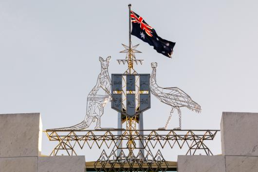 Australian Flag on Parliament House. Adobe Stock