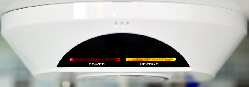 Stock image of the power indicator lights of an electric water heater