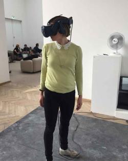 Woman wearing a VR headset and looking around.