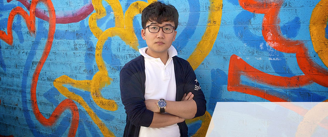 North Korean refugee against graffitti wall