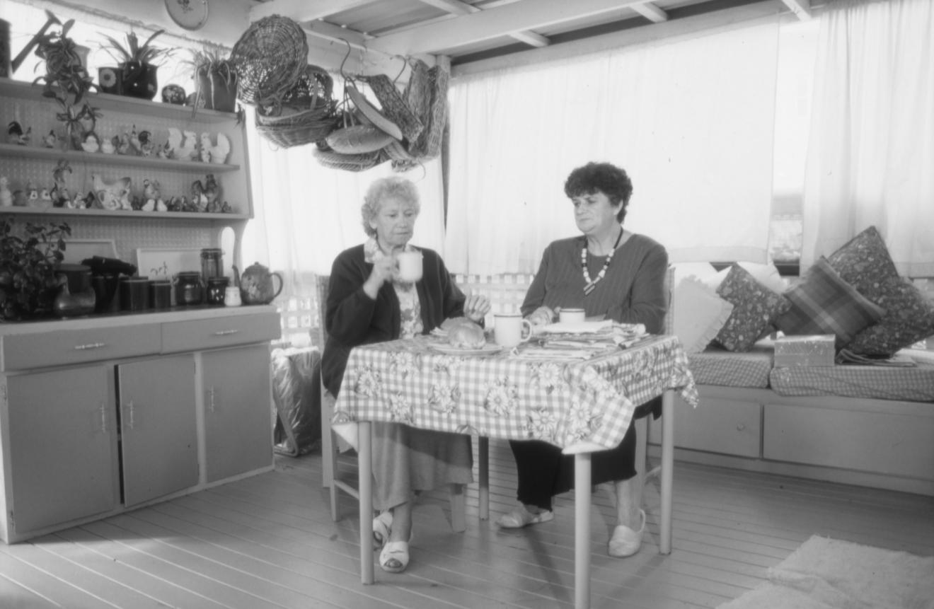 Margaret Taylor and Jean Deas (right to left) in Margaret's home, Sadleir.  Photo by Therese Sweeney