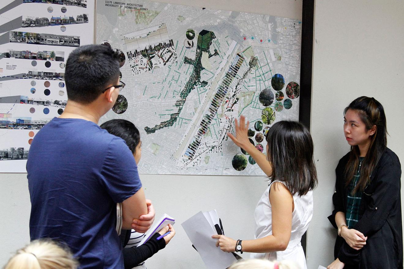group of people looking at landscape plans
