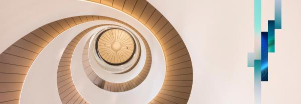 Circular staircase with blue decorative stripes on the side