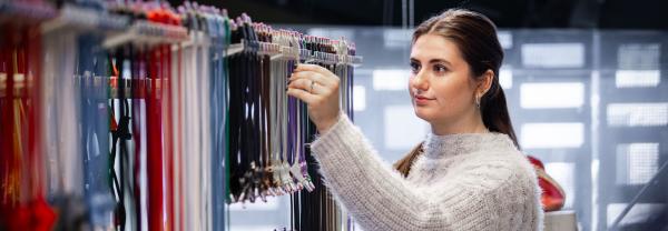 Young woman inspecting electrical wires