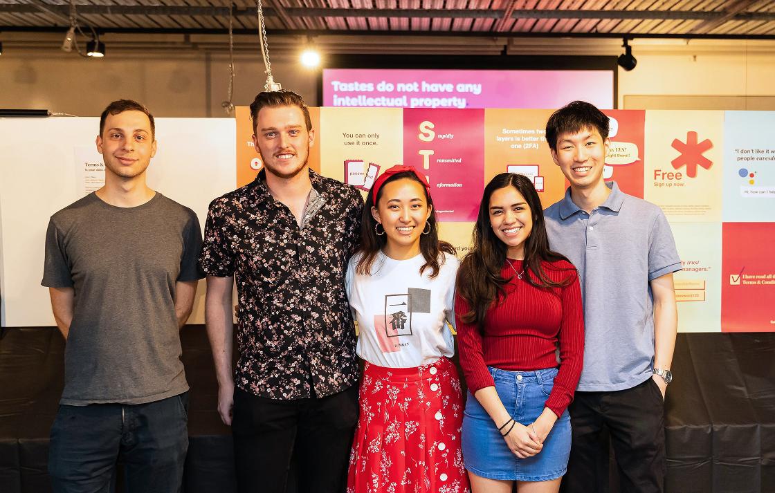 Five students in a group smiling for photographer at BCii market day 2019