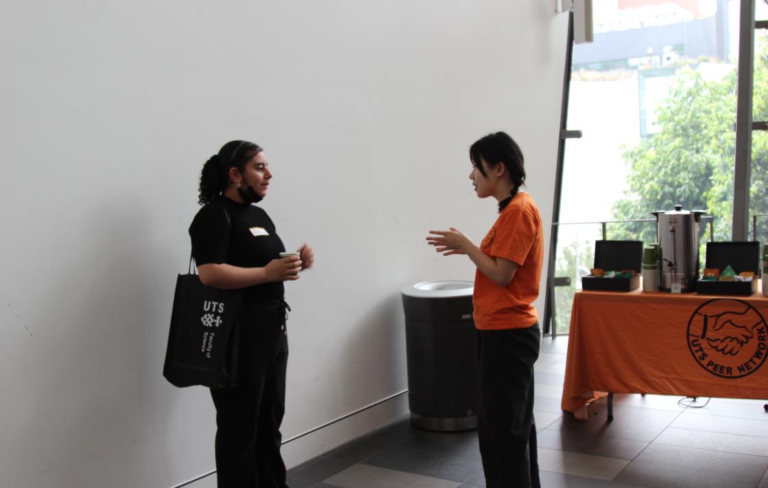 A Peer Networker talking to a student