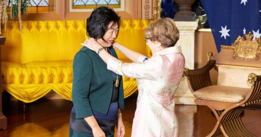 Jie Lu AO receiving Order of Australia medal from NSW Governor Margaret Beazley.