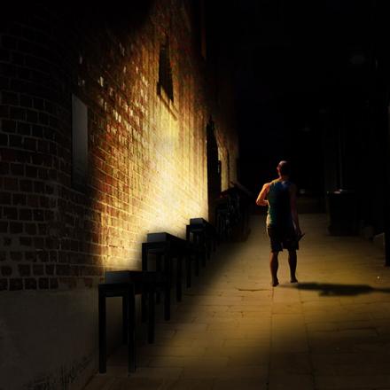 Nightscape. Single person in an alley.