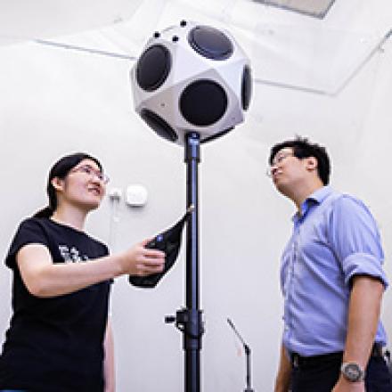 Researchers taking noise and vibration measurements with specialist instruments