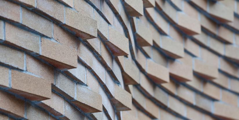 Detail of the undulating brickwork on the Dr Chau Chak Wing building facade