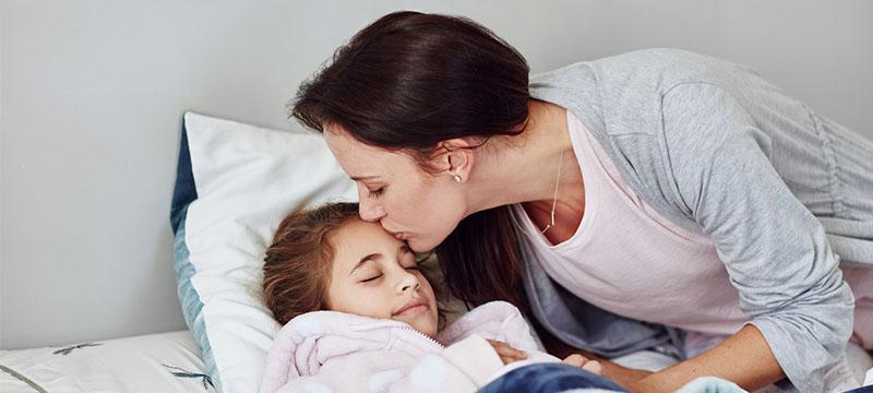 Parent putting child to bed