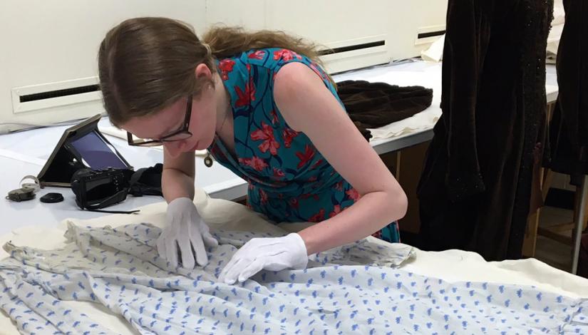 Catriona Fisk examining a potential maternity dress in the Fashion Research Collection at Ryerson University, Toronto, 2016