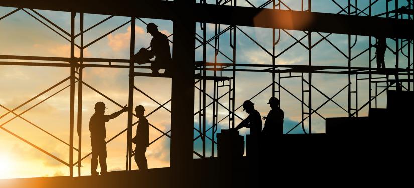Silhouette of workers on a construction site