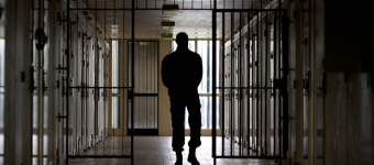 A warden patrols in the corridors of the Bois d'Arcy jail on July 8, 2014, near Paris.