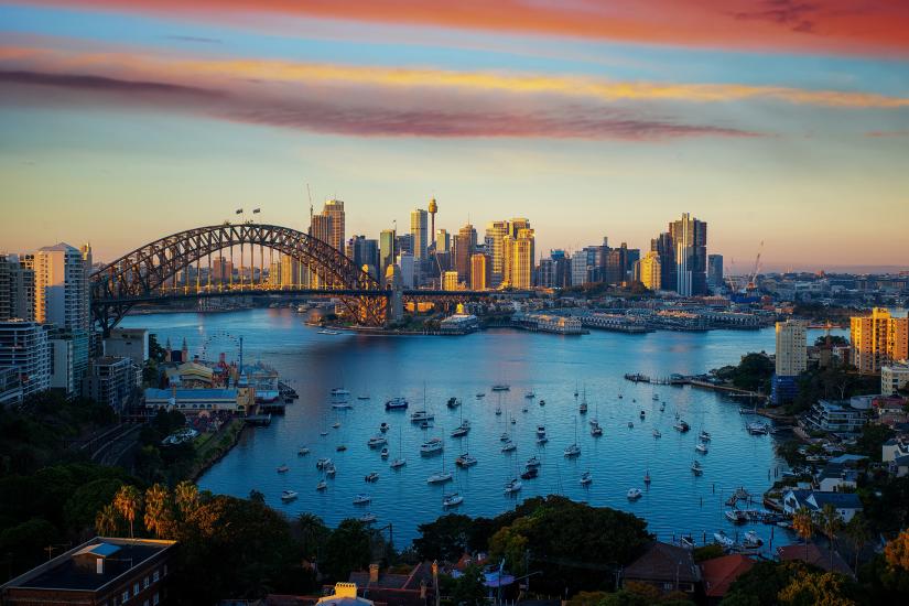 Sydney Harbour, Sydney Harbour Bridge, and Sydney City at sunset.