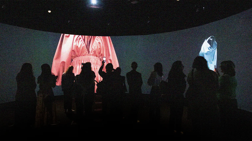 People stand within a digital exhibition