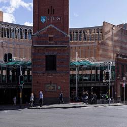 A red-brick heritage facade fronts on to a busy intersection
