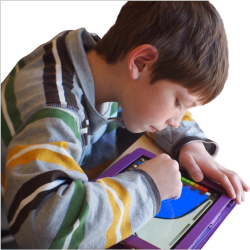 Photo of a child using a tablet device; image by Lexie Flickinger via Flickr