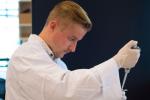 uts researcher in a white coat in a lab