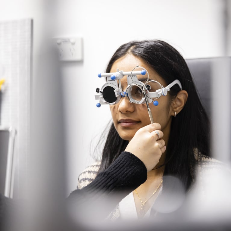 Master of Orthoptics student during an eye exam.