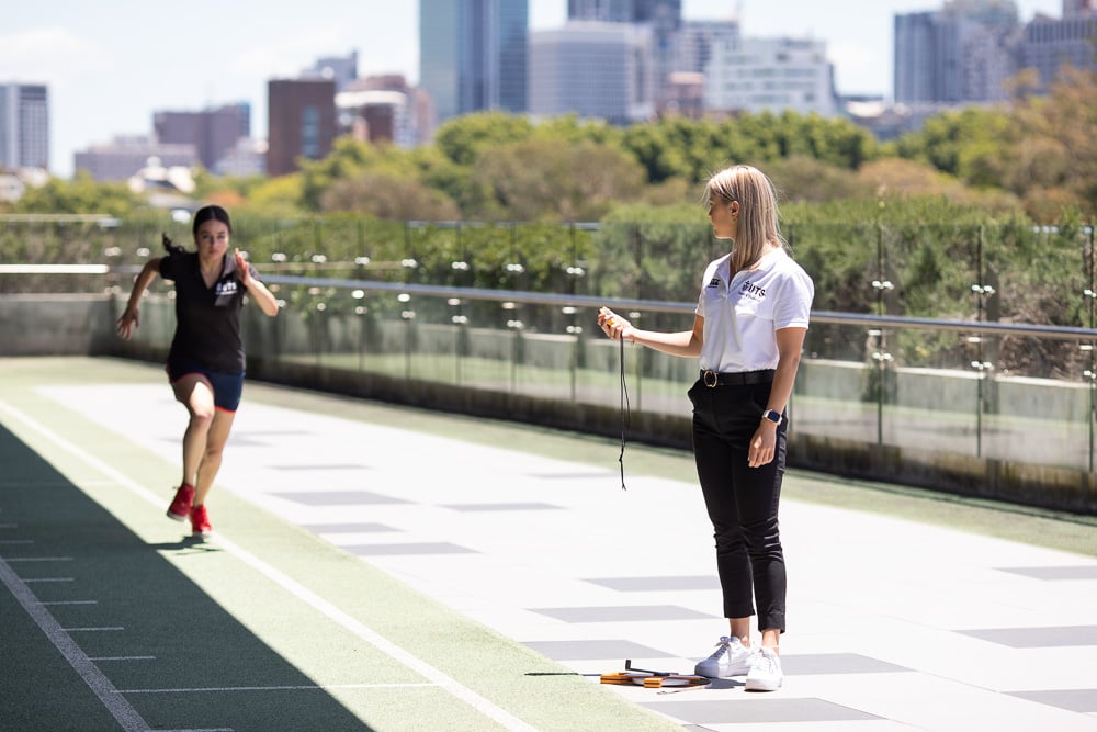 Student on running track