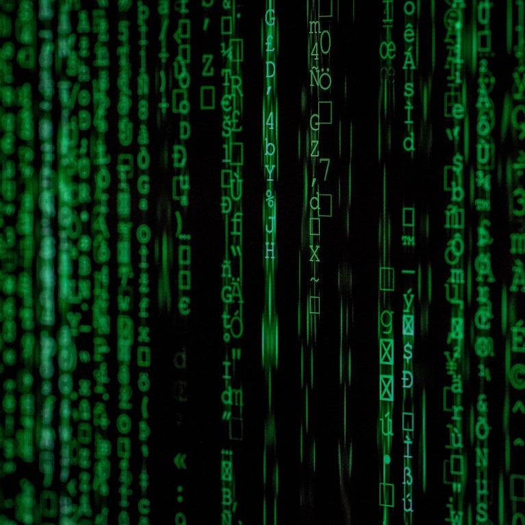 Black screen with floating green text.