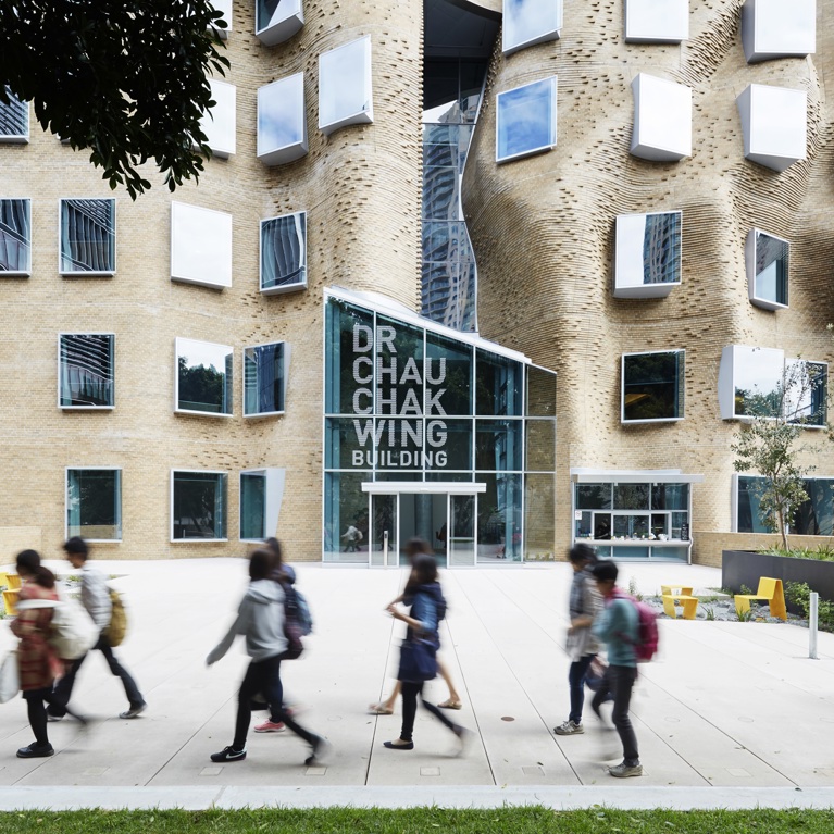University of Technology Sydney students walking in front of the Dr Chau Chak Wing building