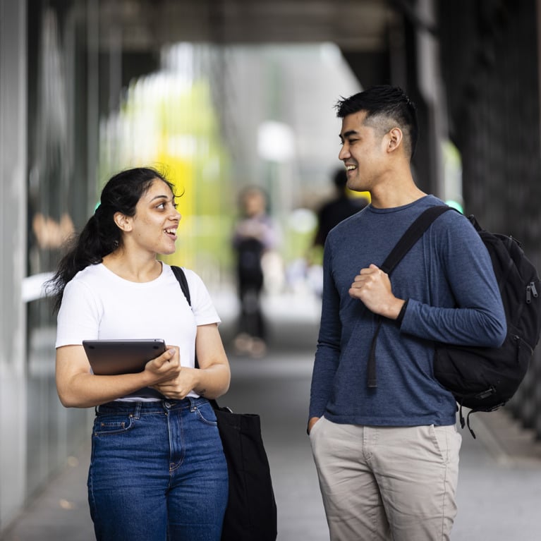 Two University of Technology Sydney students walking through campus