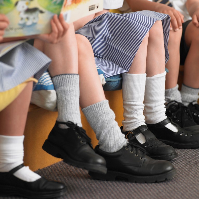 Students Sitting In Row In Classroom by moodboard/Adobe Stock