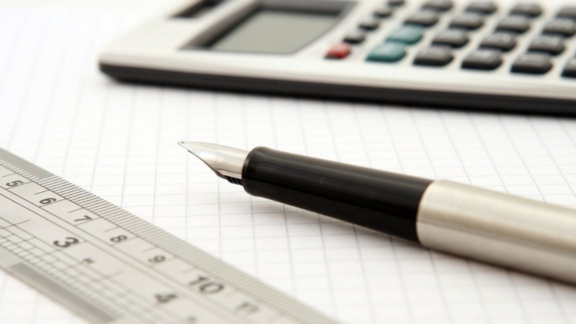 A ruler, pen and calculator