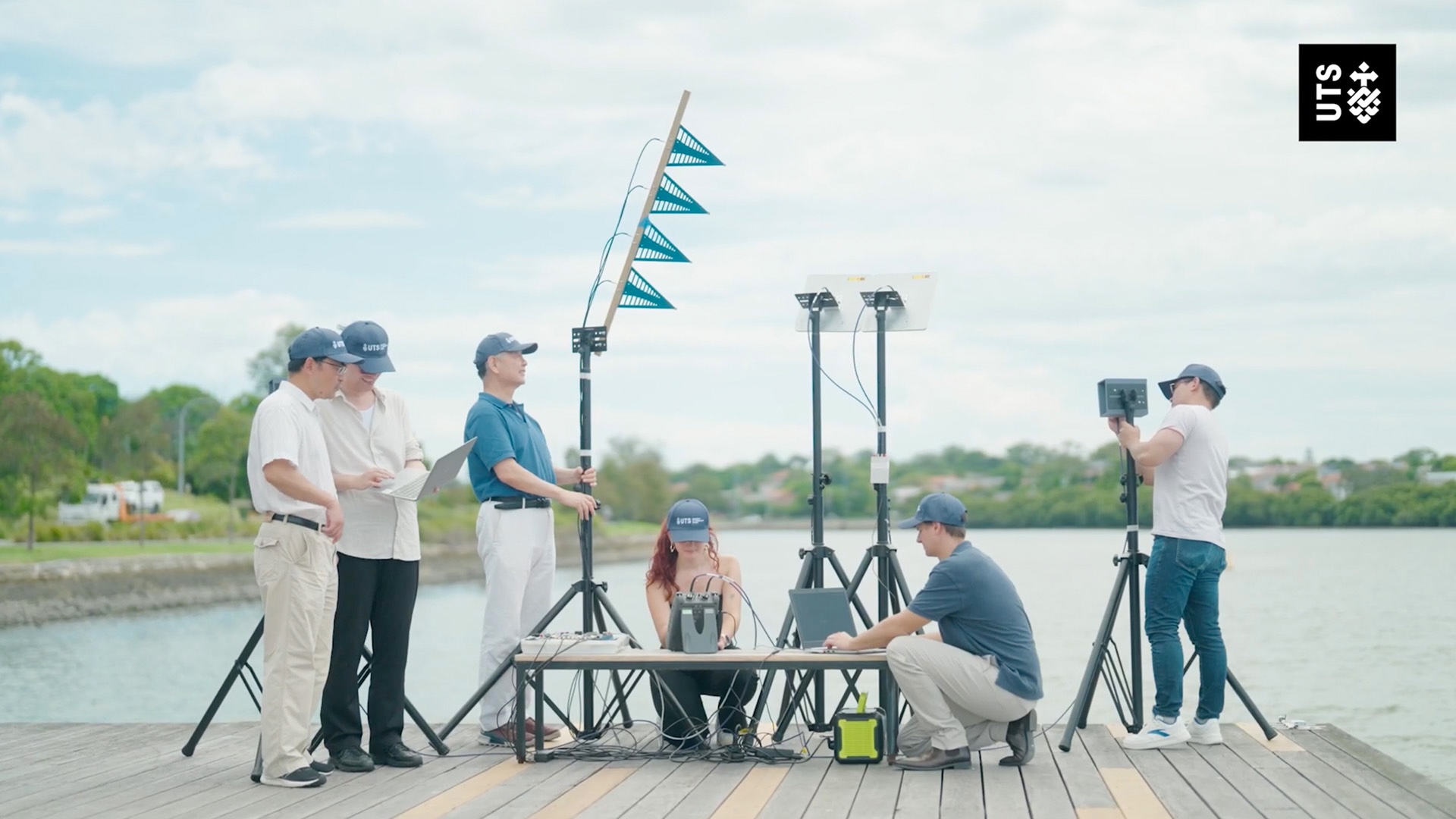 Network Sensing Lab team working with technical equipment on a wharf