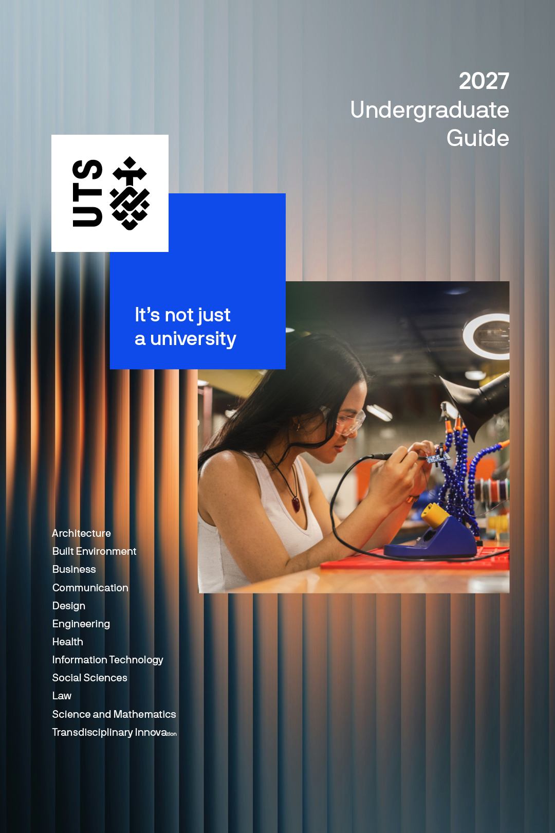 Female student in red top smiling in front of UTS Central.