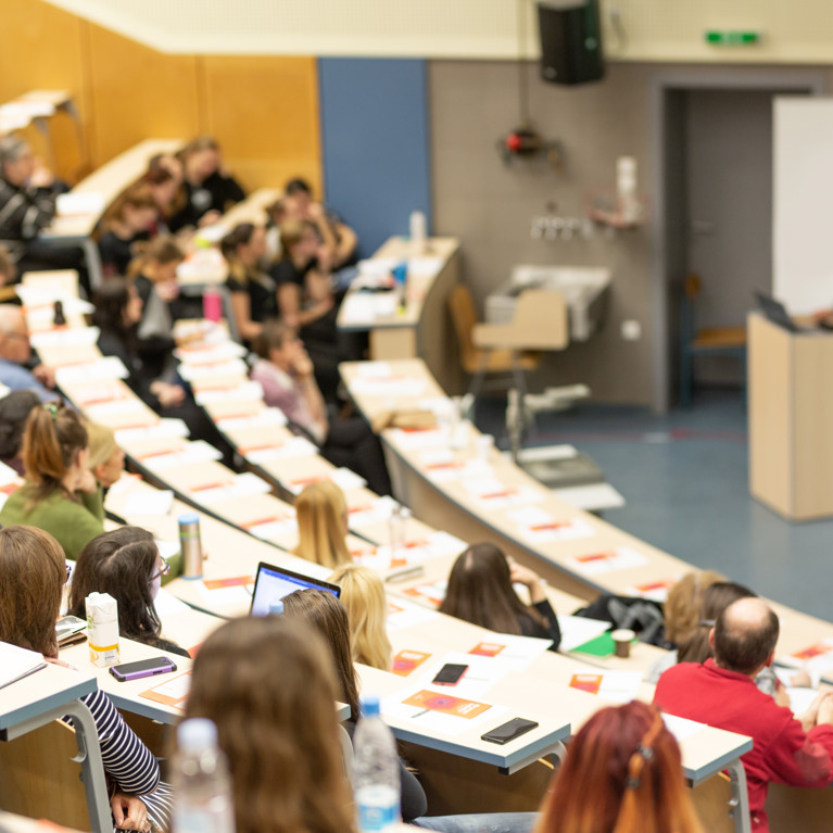 Students in lecture theatre. Adobe Stock