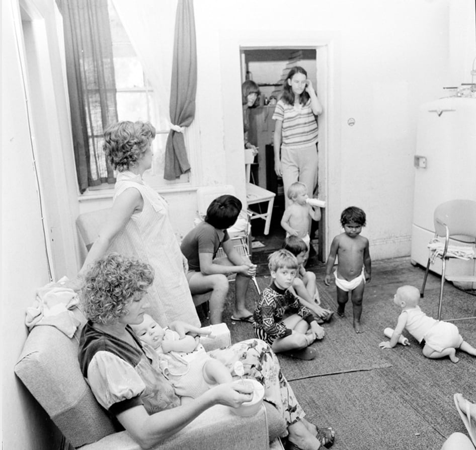 Women and young children gathered in the living room at Elsie Women’s Refuge, Sydney.