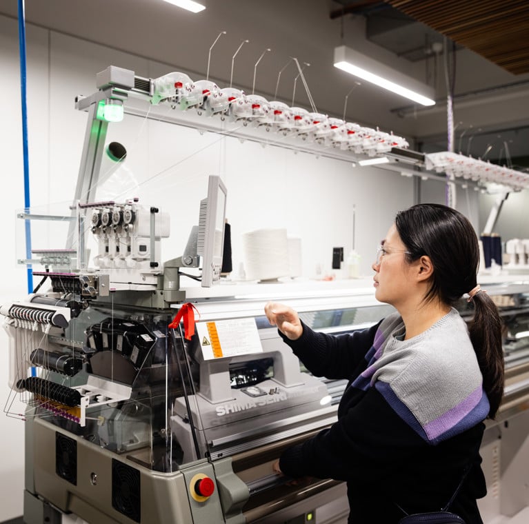 Technical Expert Shirley Tam using the Shima Seiki WHOLEGARMENT knit machine. Photo: Andy Roberts