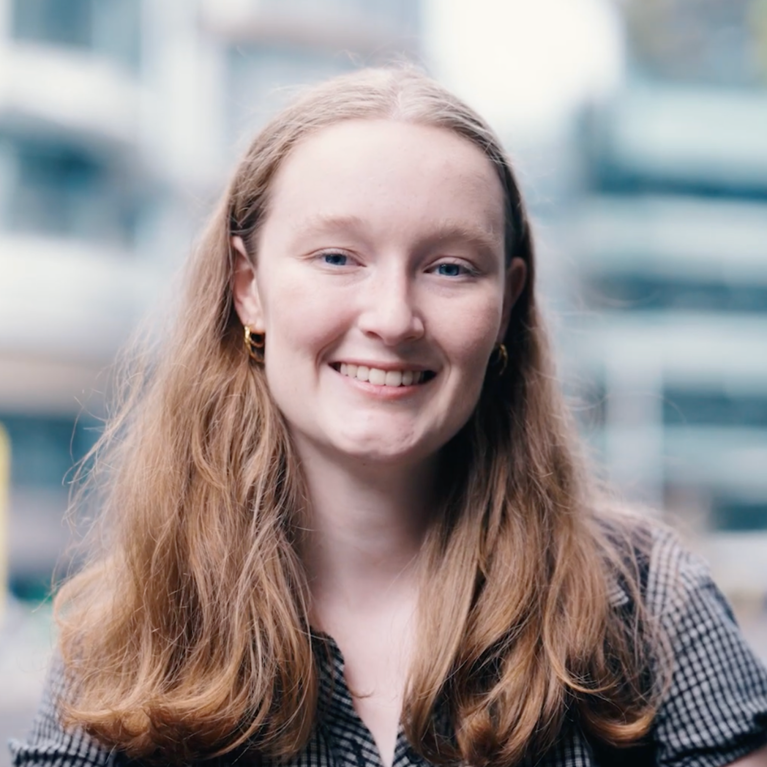 Headshot of Olivia Daffy in front of UTS campus.