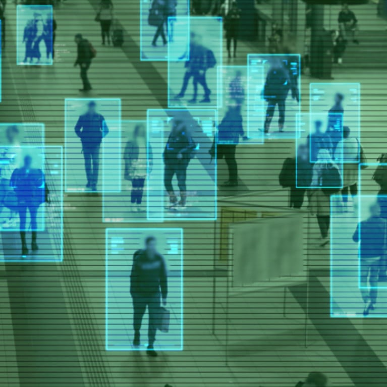 Scanning a crowd of people walking at a railway station. Surveillance interface using artificial intelligence and facial recognition. Picture: Adobe Stock