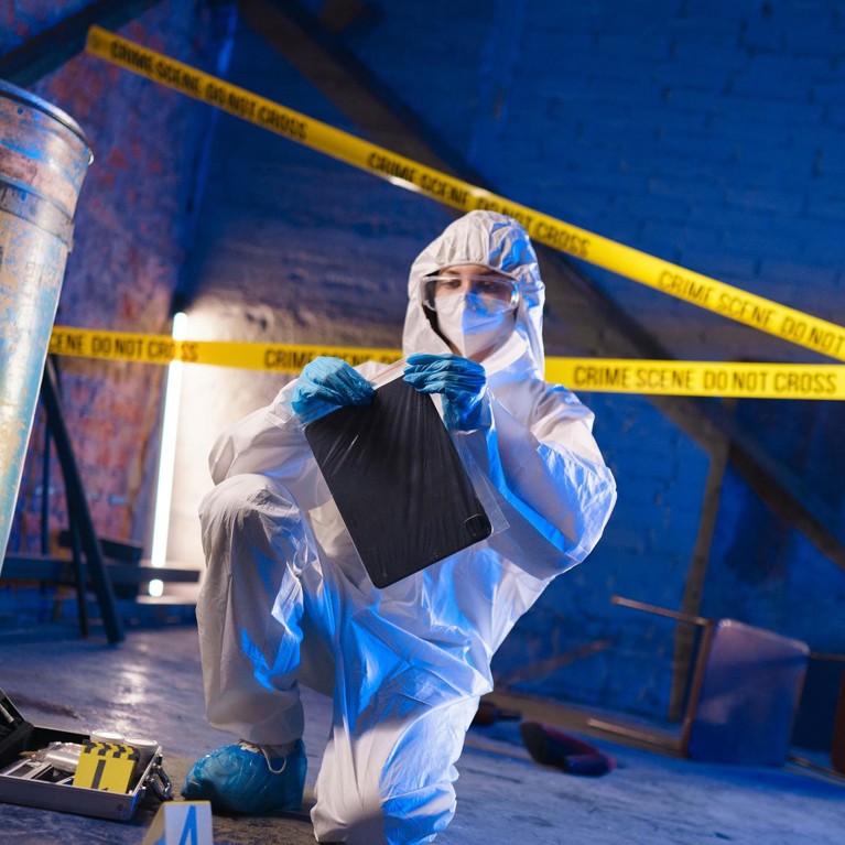forensic scientists bagging evidence