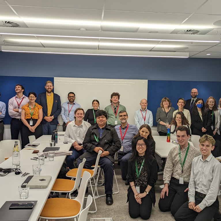 Group photo of students and staff at a Centre for Work Health and Safety directorate meeting.