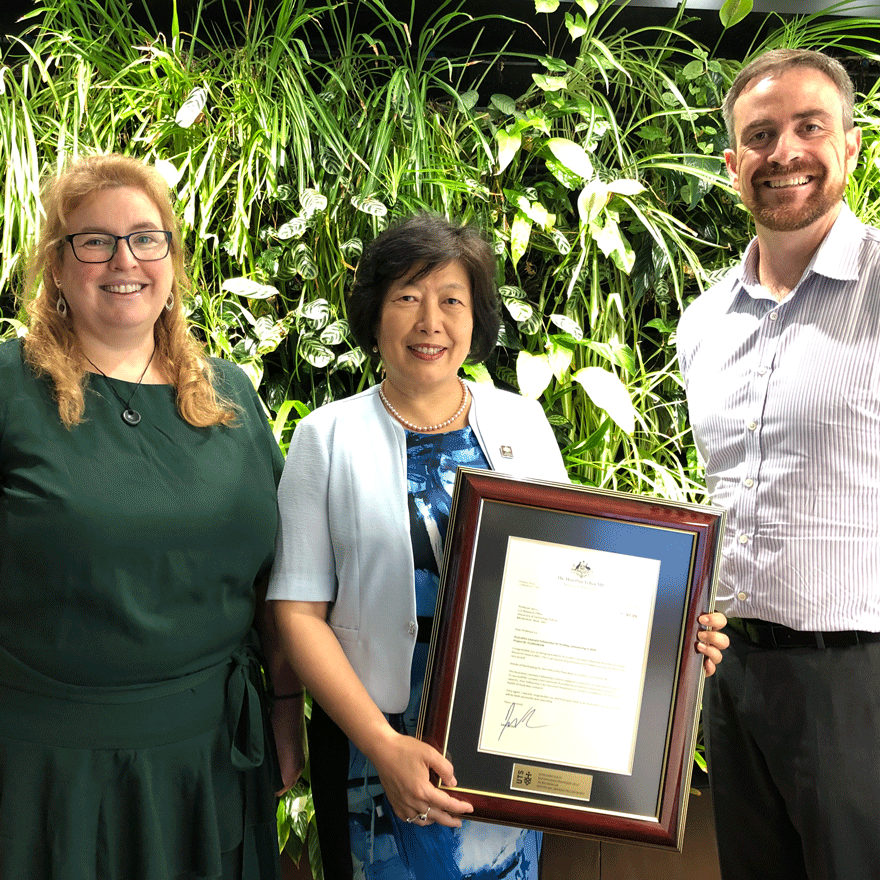 Distinguished Professor Jie Lu receiving a certificate