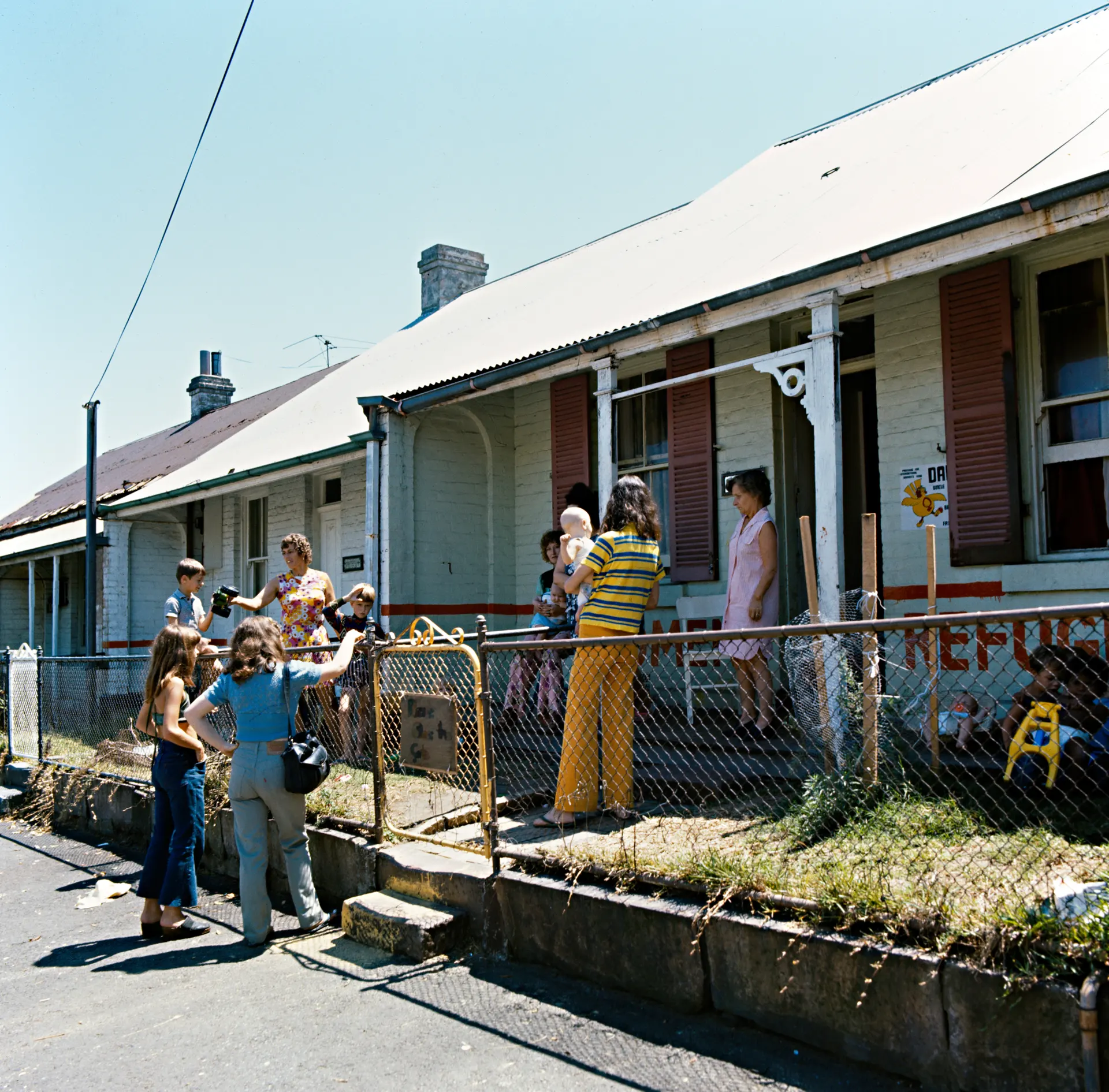 Women gather outside Elsie Women’s Refuge