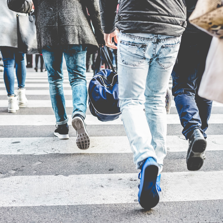 Crowd of people walking on zebra crossing street city centre. Picture: Disobey Art/Adobe Stock