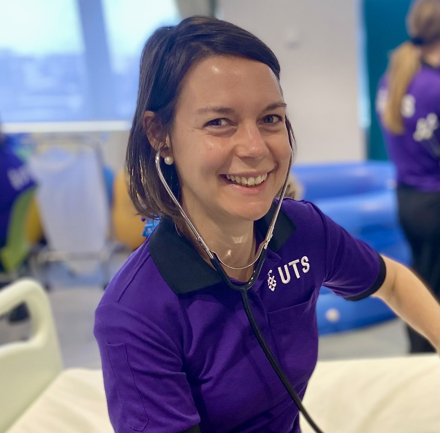 Laura in her nursing uniform during class.
