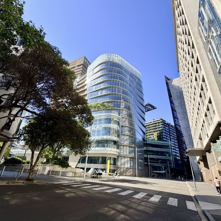 UTS main campus. Green trees, blue sky, new Library building.