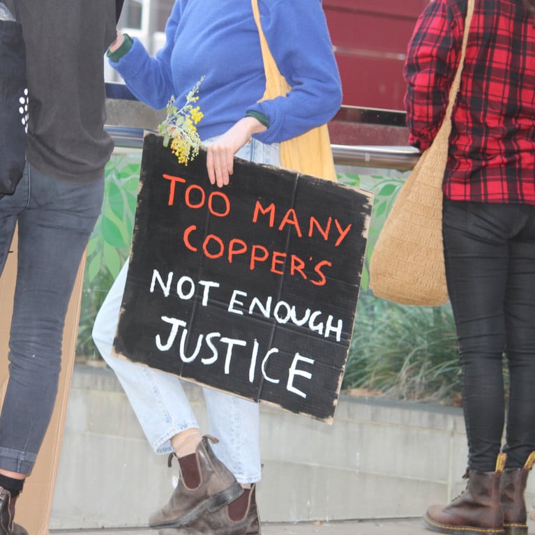 Sydney, NSW / Australia - June 6 2020: Black Lives Matter Protest March. Protesting Aboriginal deaths in custody and the death of. Sign reading 'Too many coppers, not enough justice'. Picture by Rose Makin/Adobe Stock