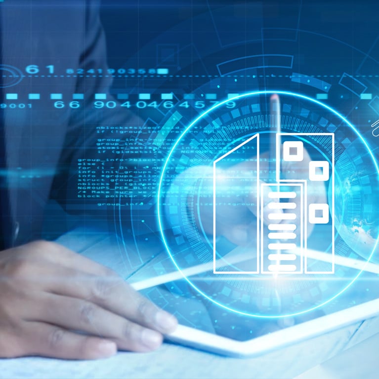 A person in a suit interacts with a digital tablet. Futuristic interface elements and icons suggest technology and data flow, creating a modern, innovative tone.