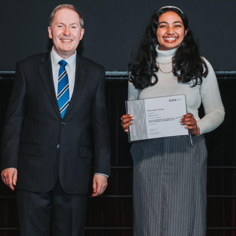 Chanchal receiving the Dean's Merit Award.
