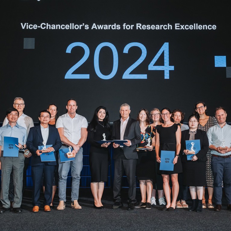 Group of award winners on stage at the 2024 UTS Vice-Chancellor's Awards for Research Excellence