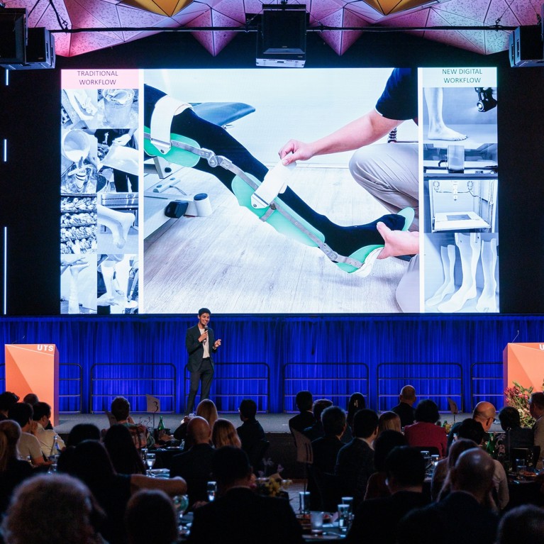 Ahmed Da'na presents his Three Minute Thesis on stage at the 2025 Vice-Chancellor's Awards for Research Excellence.